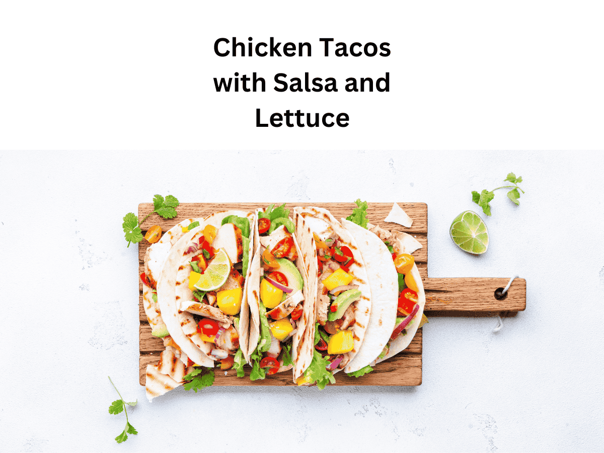 Shredded chicken tacos topped with lettuce, cheese, and salsa.