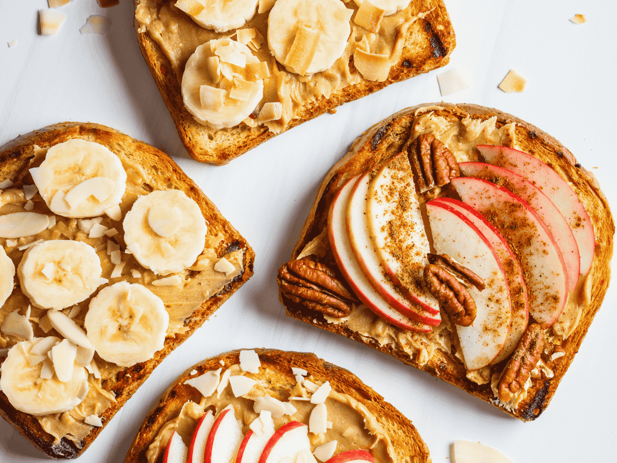 Peanut butter banana bread with creamy texture and topped with chopped nuts.